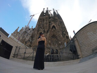 Girl in Barcelona in front of Sagrada Familia