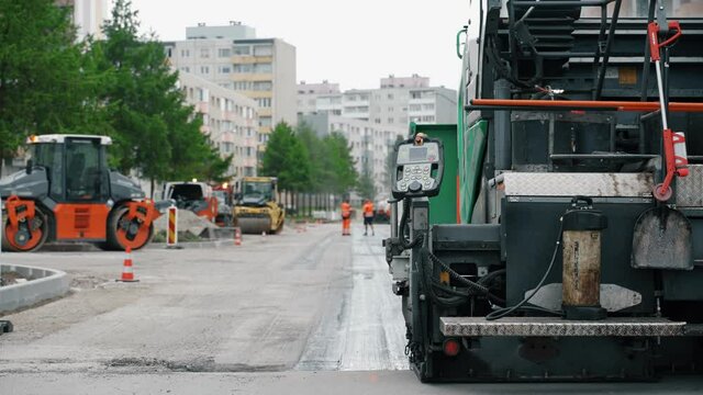 Road paving machine working on the street.