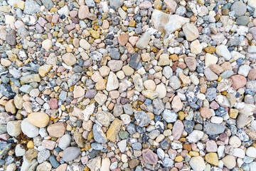 Stone background with Baltic Sea stones. Colorful stones.