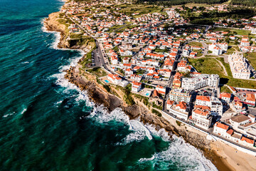 Aerial view of Praia das Macas little township by Portuguese coastline, Colares, Portugal