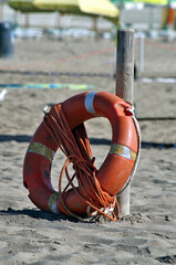 lifebuoy and rope on the beach