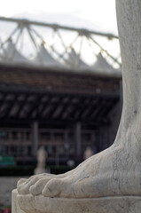 a marble white foot in a blurried background