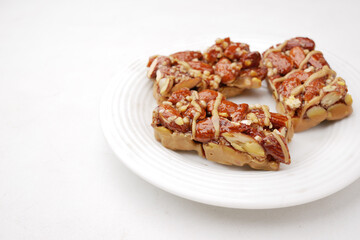 Almond and oat protein bars on white background .