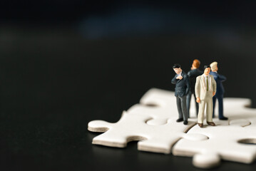 Miniature people Group Business man mini figures standing thinking on Jigsaw Puzzle black...