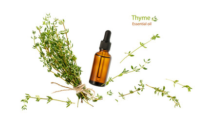 Thyme essential oil glass bottle,  aromatic herbs bunch and twigs flying isolated on white background.