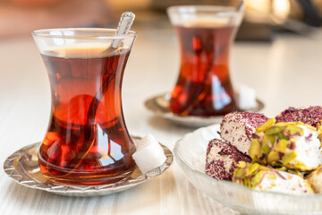 Traditional style turkish tea cup with turkish delay on the table