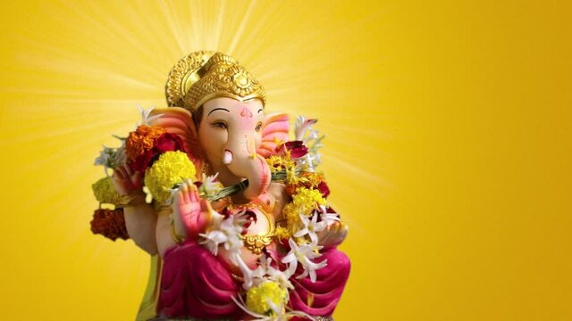 Indian Festival , Lord Ganesha over yellow background