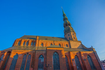 Fototapeta na wymiar Riga St. Peter's Church - the tallest peak in Riga, is one the oldest and most valuable monuments of medieval architecture in the Baltic States
