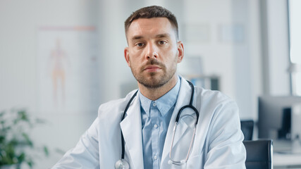 Naklejka na ściany i meble Web Doctor's Online Medical Consultation: Portrait Shot of Caucasian Male Physician is Making Conference Video Call with a Patient. Health Care Specialist Giving Advice. POV Point of View Shot