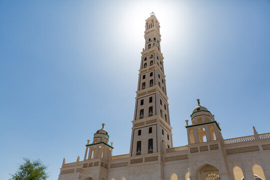 beautiful long minaret and architecture of Al-Muhdhar Mosque and blue sky at historical town of