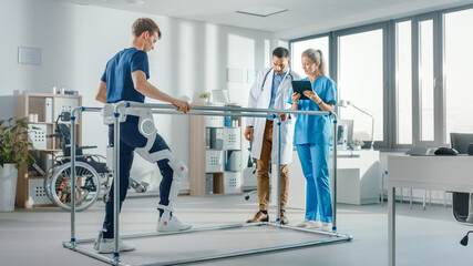 Modern Hospital High-Tech Physical Therapy: Patient with Back Injury Wearing Advanced Robotic...