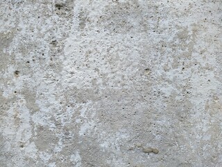 old and white concrete wall with which paint peels off.