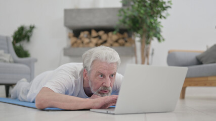 Old Man Using Laptop, Laying on Excercise Mat 