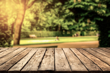 Wooden table in the park on a beautiful autumn day 