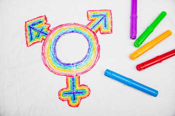 lgbt symbol on a white shirt with textile pens besides