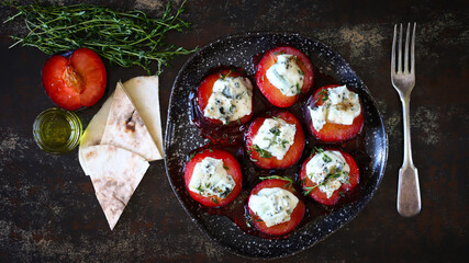 Baked plums with dor blue cheese and thyme. Gourmet recipes with plums. Autumn dishes.