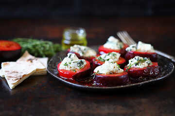 Baked plums with dor blue cheese and thyme. Gourmet recipes with plums. Autumn dishes.