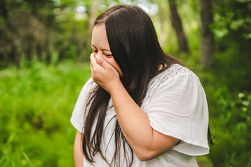 Portrait of trisomy adult outside having fun