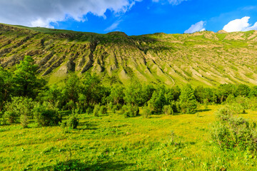 Fototapeta na wymiar Magnificent mountain and green grassland in Xiata Scenic Area,Xinjiang,China.