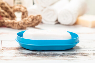 Obraz na płótnie Canvas soap on a blue soap dish isolated on a white background. hygiene concept