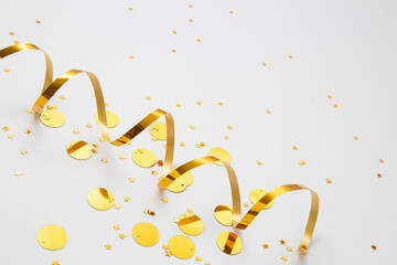 gold stars and tinsel on white background