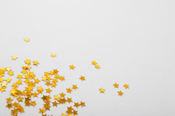 golden stars confetti on white background