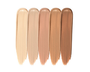 Different shades of liquid skin foundation on white background, top view