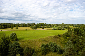 Rural landscape with road, meadows and trees