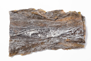 Dried nori seaweed laminaria sheets. Nori seaweed dried in flat sheets. Wrinkled brown background. For making sushi, rolls and other dishes. Background for asian food. Crispy dried seaweed.