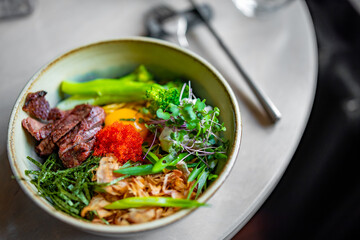 No Broth Mazemen Ramen with beef and Vegetables and caviar in bowl