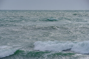white cap waves and crystal clear salt ocean water washes up on a Atlantic Coast Beach
