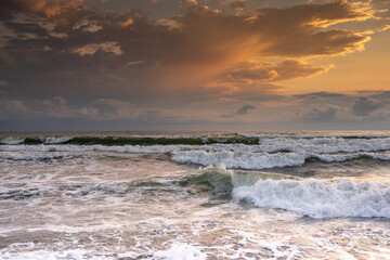 Charming sunset on the black sea beach in Georgia.