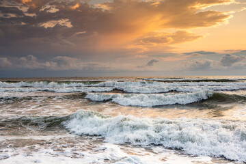 Charming sunset on the black sea beach in Georgia.