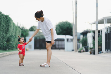 baby step in outdoor to practice balance walk in development according to the age of the child with...