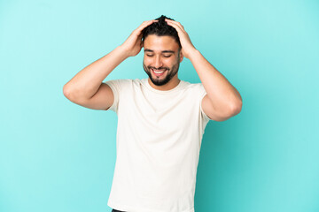 Fototapeta na wymiar Young arab man isolated on blue background laughing