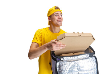 Close up young delivery man in yellow uniform with paper box with pizza isolated on white background. Concept of convenience, speed, comfort, safety, service.