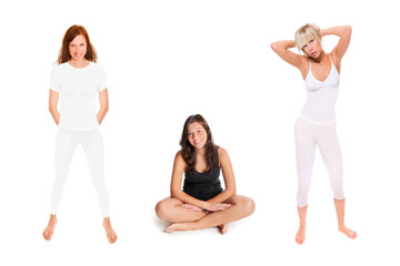 Three full length portraits of slim young women wearing white and black sportswear, isolated in front of white studio background