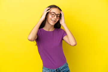 Young French woman isolated on yellow background laughing