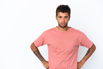 Fototapeta premium Young handsome Brazilian man isolated on white background angry