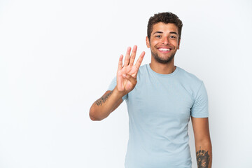 Fototapeta premium Young handsome Brazilian man isolated on white background happy and counting four with fingers