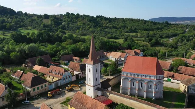 Cloaster, Romania - Flying drone aerial view of Saxon village in Transylvania
