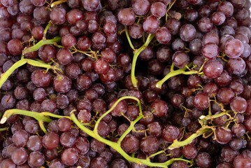 healthy fruit Grape background/ red wine grape background/ dark grapes, red grapes in supermarket, local market, bunch of ready-to-eat grapes.