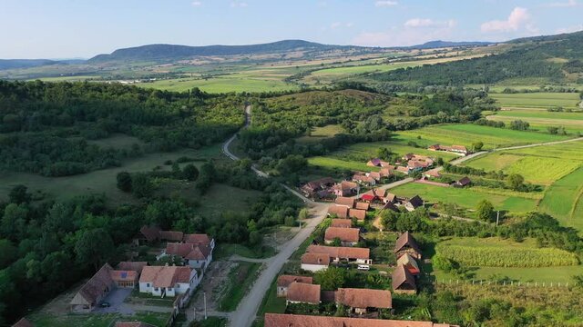 Cloaster, Romania - Summer flying drone aerial view of Saxon village in Transylvania