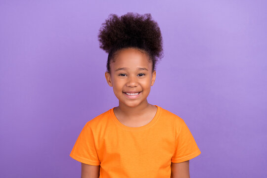 Photo of young cheerful little afro girl happy positive toothy smile isolated over violet color background