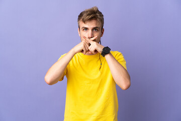 Young handsome blonde man isolated on purple background showing a sign of silence gesture