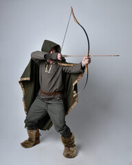 Full length  portrait of  young handsome man  wearing  medieval Celtic adventurer costume with...