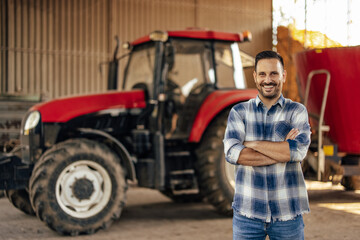Adult man, showing off his tractor.
