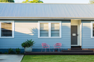 night shift worker asleep sign on front door of house with neat front yard