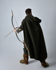 Full length  portrait of  young handsome man  wearing  medieval Celtic adventurer costume with...