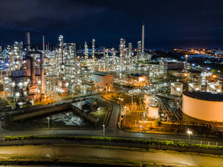 Fototapeta na wymiar Aerial view Oil refinery. Industrial view at oil refinery plant form industry zone with sunrise and cloudy sky.
